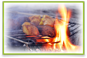 Photo of baked potatoes on a campfire